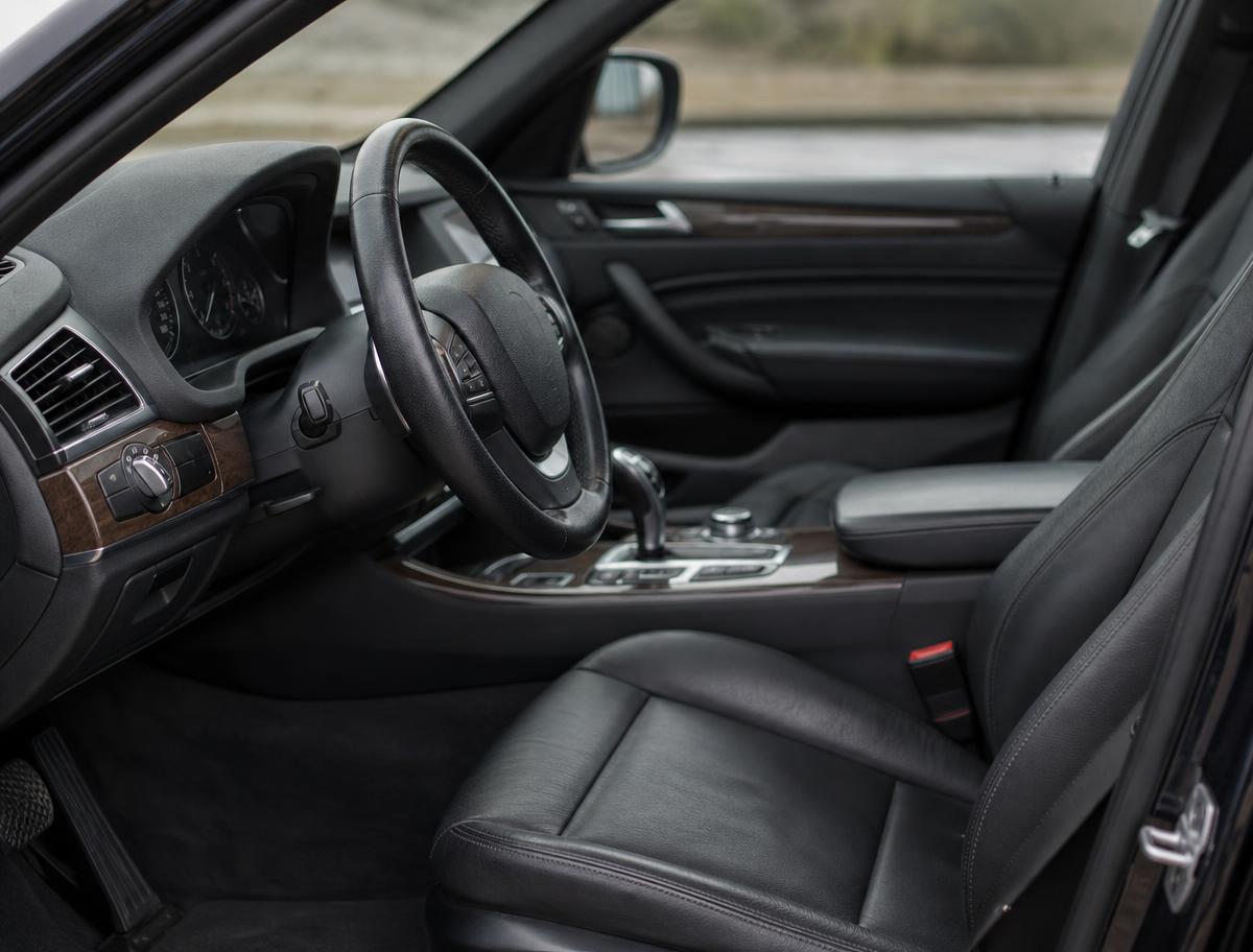 Freshly conditioned black leather car interior